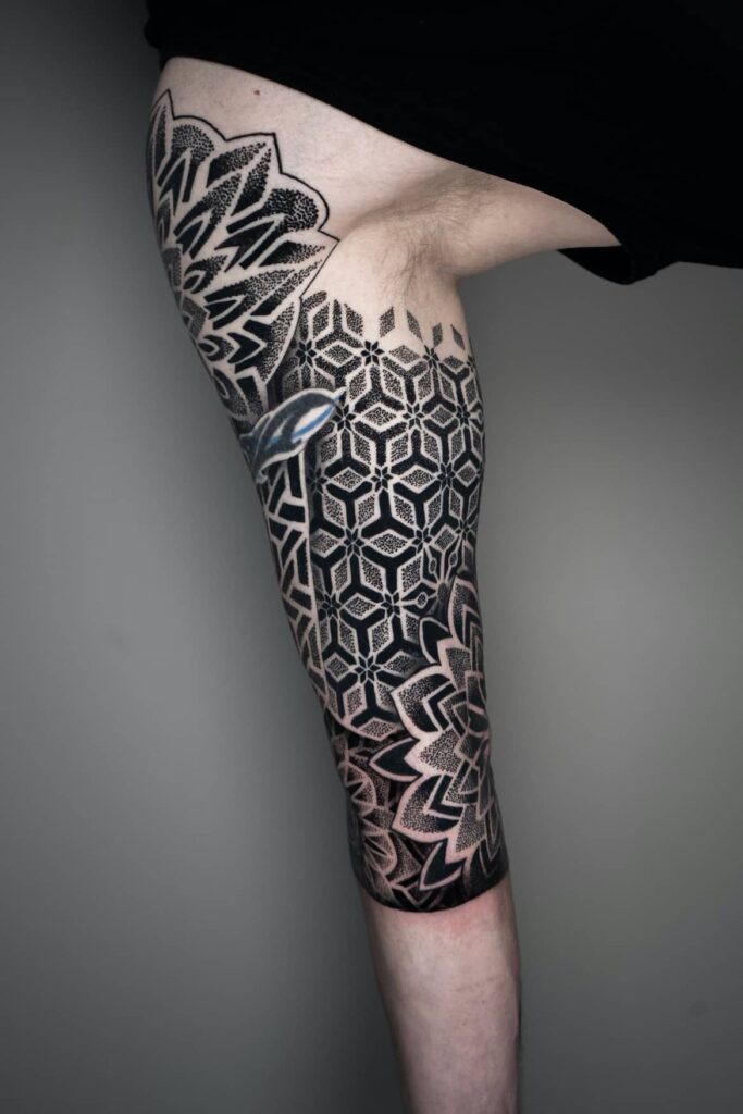 Photo of geometric sleeve tattoo completed by Brad Reis