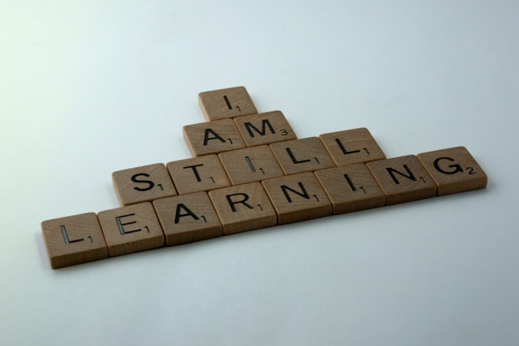 Scrabble tiles spelling I am still learning